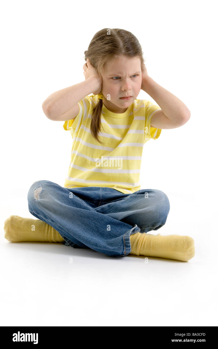 Non sto ascoltando - ragazza copre le sue orecchie Foto Stock
