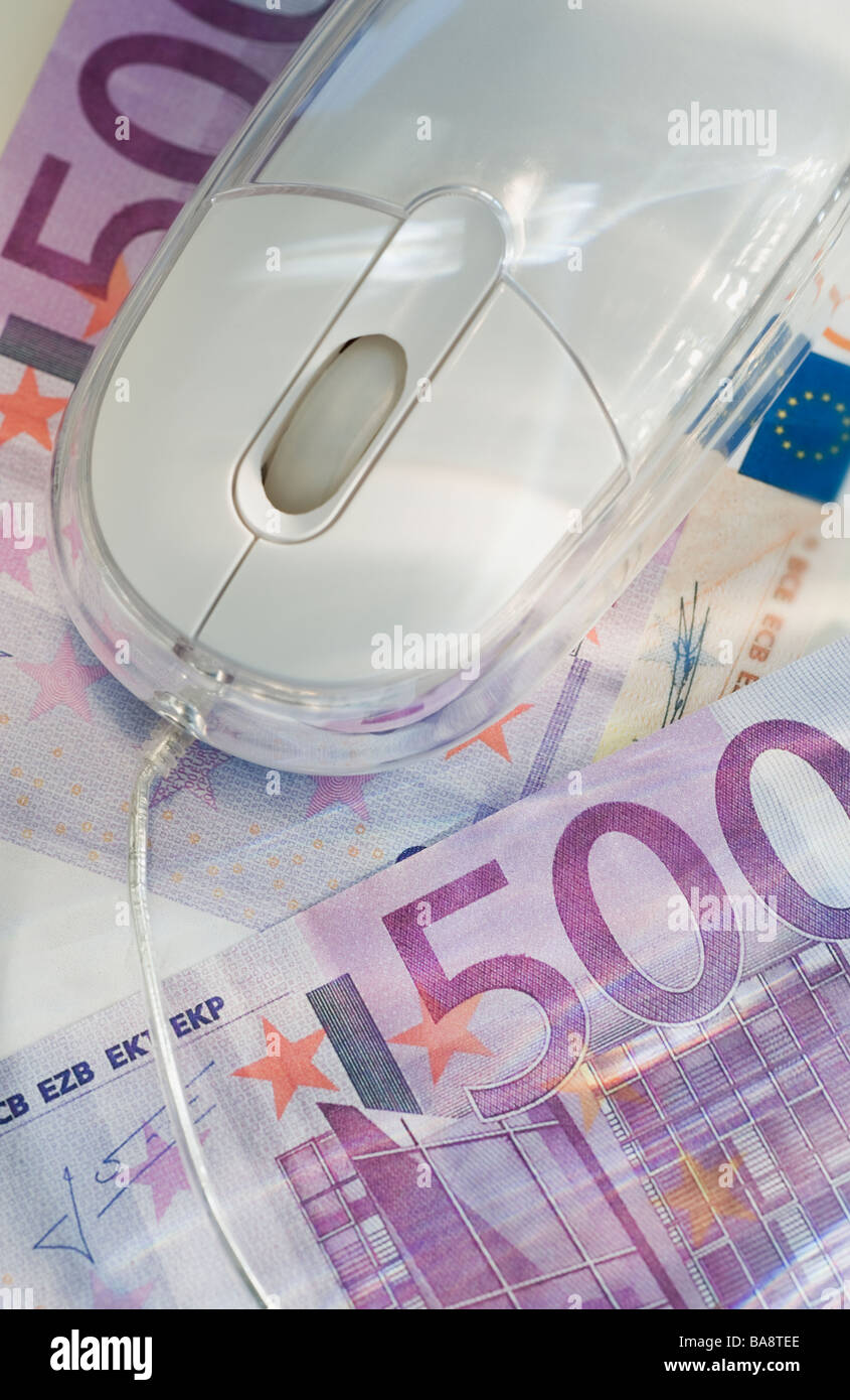 Le banconote in euro e il mouse del computer Foto Stock