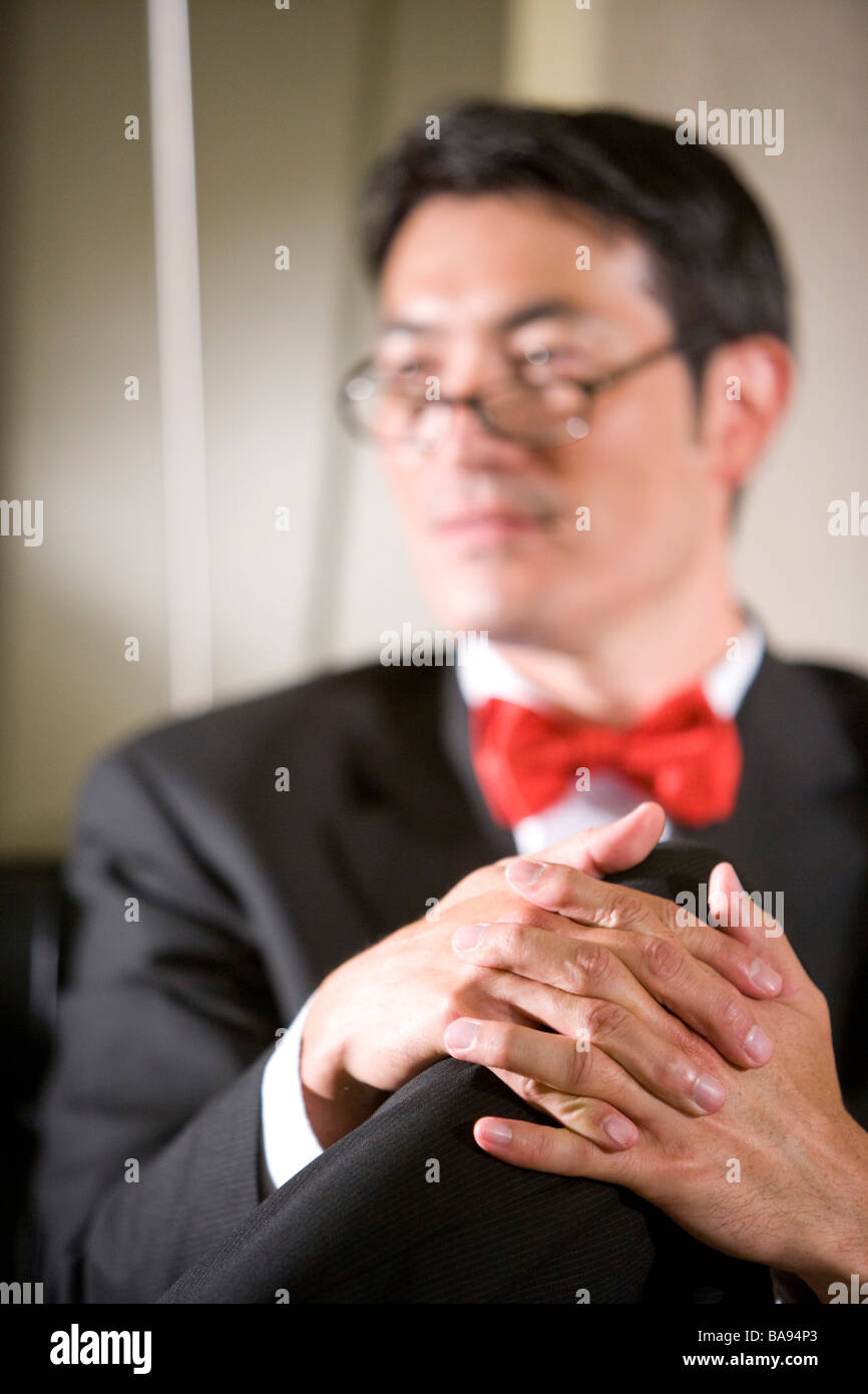 Mani giunte di imprenditore asiatica Foto Stock