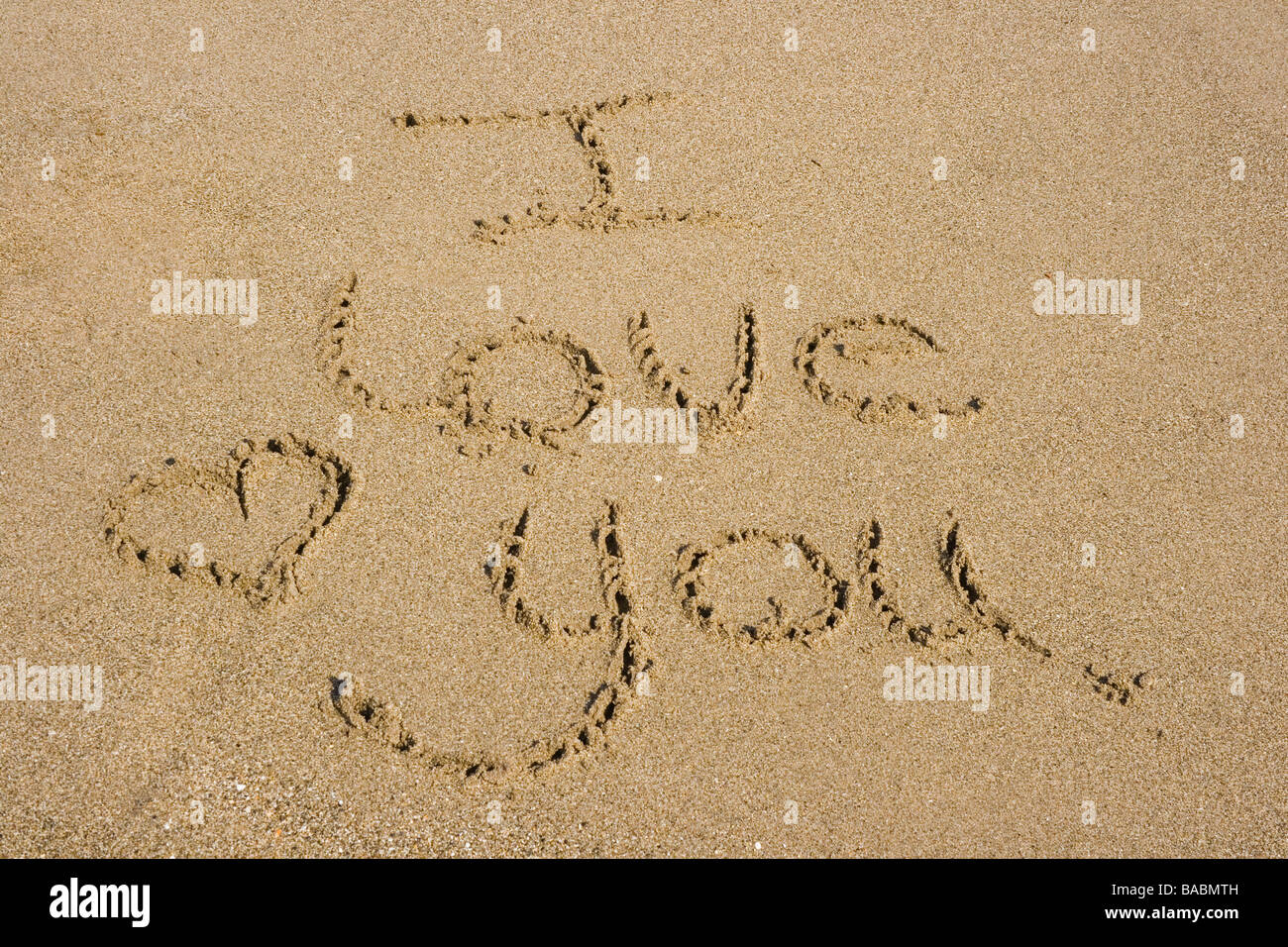 Ti Amo scritto nella sabbia Foto Stock