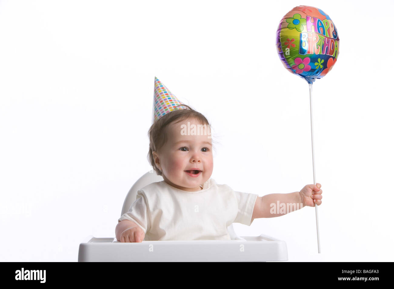 Bambino con party-hat e Buon Compleanno palloncino Foto Stock