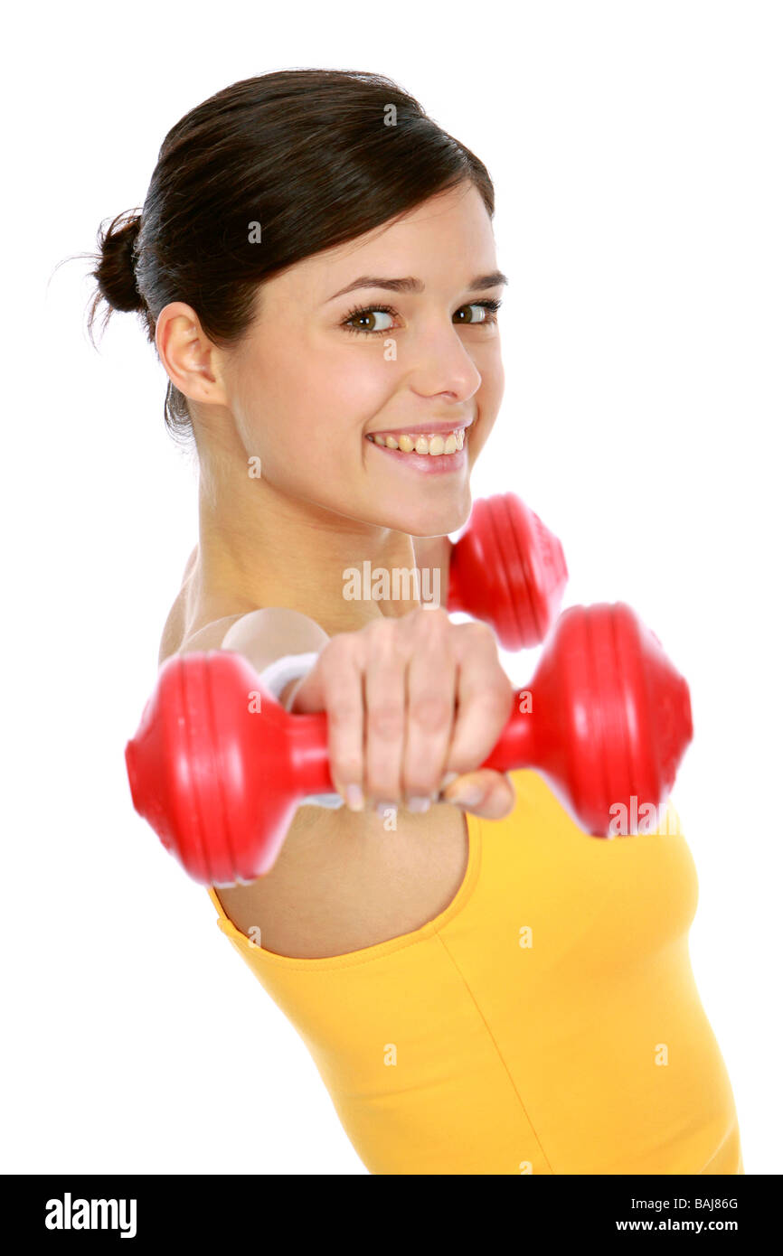 Junge Frau in Sportdress beim Hanteltraining, donna che esercitano con il manubrio Foto Stock