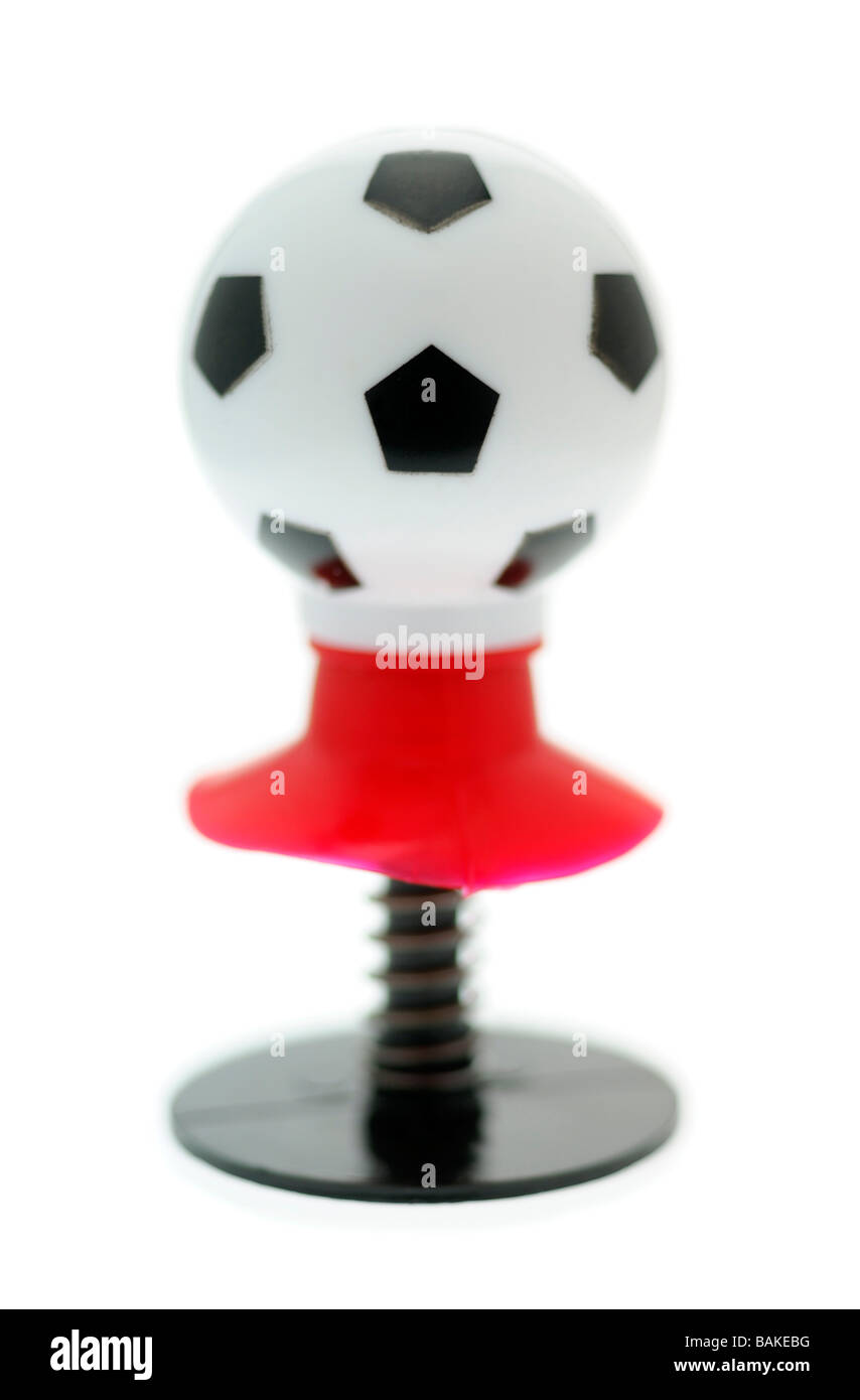 Il calcio di un giocattolo a molla Foto Stock