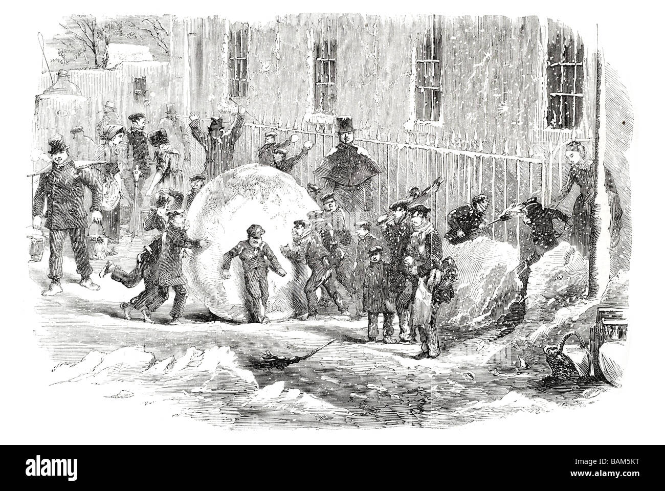 La raccolta di come va una gigantesca palla di neve in inverno la neve Foto Stock