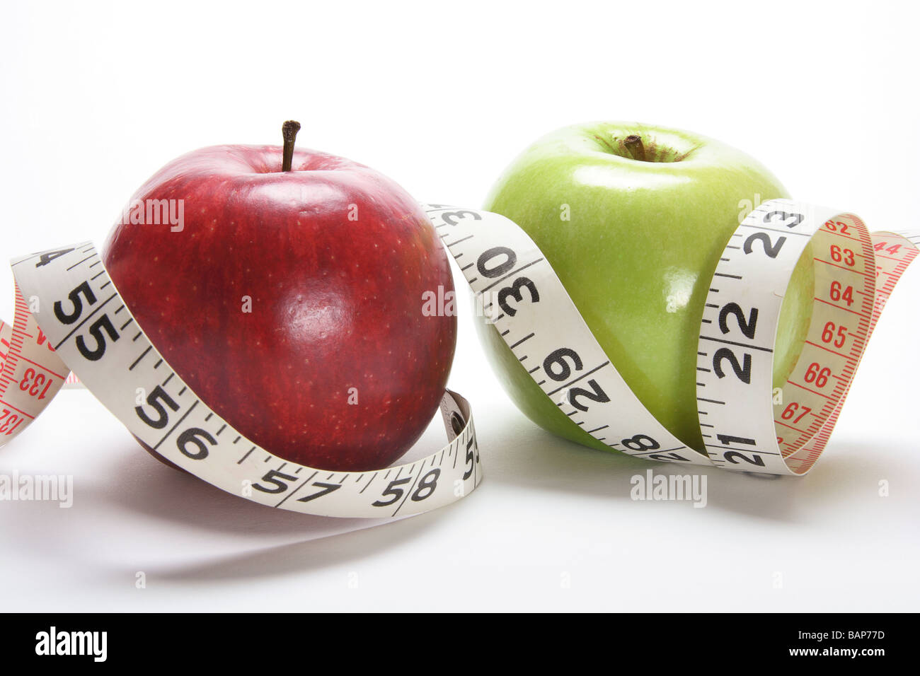 Mele e nastro di misurazione Foto Stock