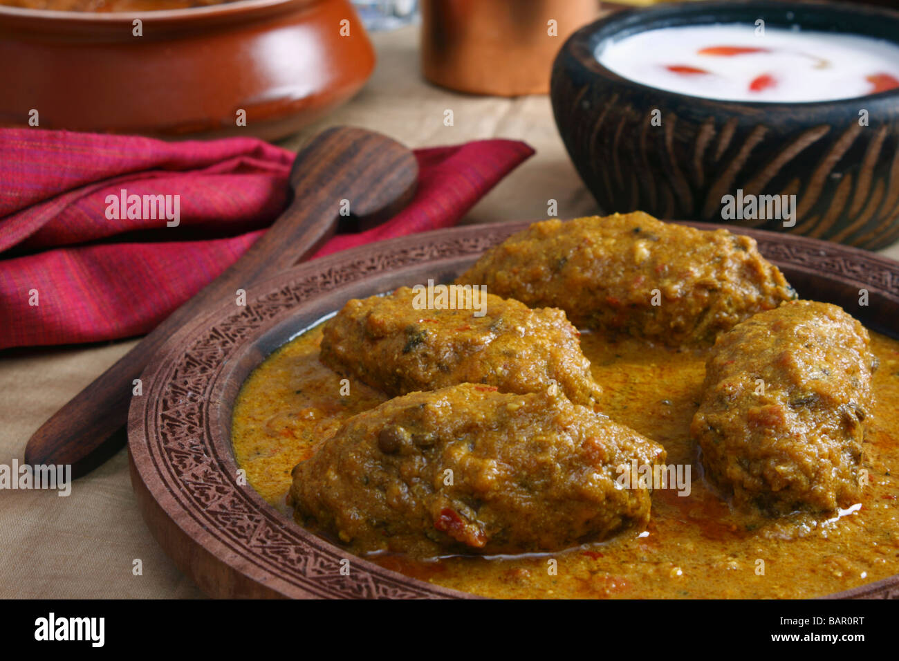 Machh montone kofta è un piatto del Kashmir fatta di fritte di montone tritata con spezie e cotta nel pomodoro saporita di sugo di cipolla Foto Stock
