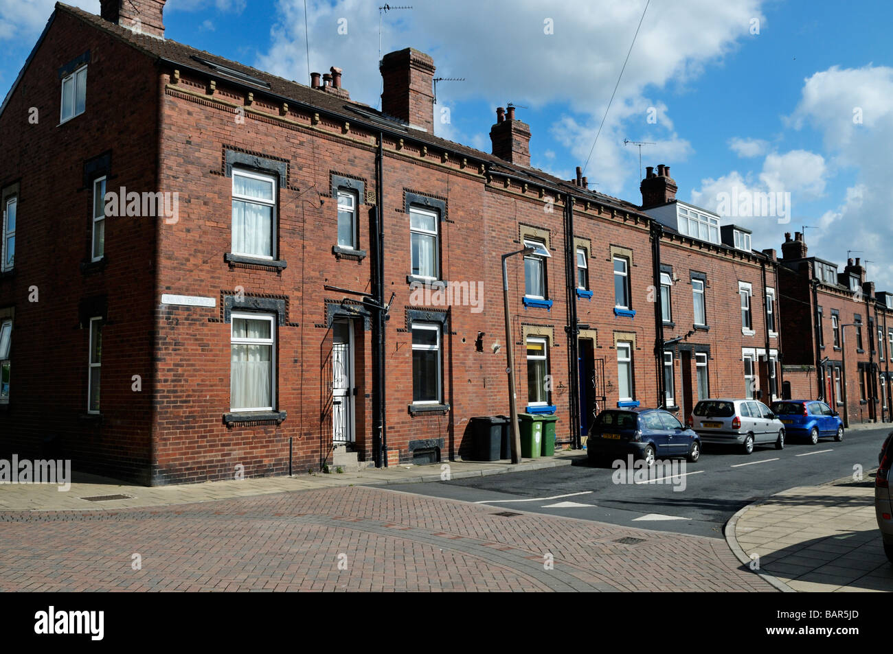 In stile vittoriano in mattoni rossi di schiena classe operaia case Terrazza Leeds West Yorkshire Inghilterra Foto Stock