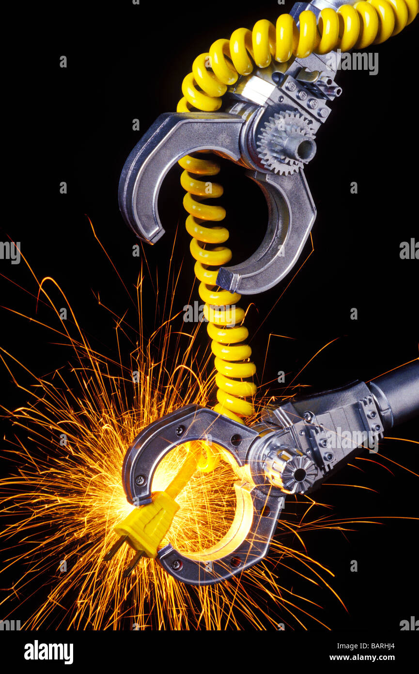 Due bracci robotici con giallo cavo scintillante Foto Stock