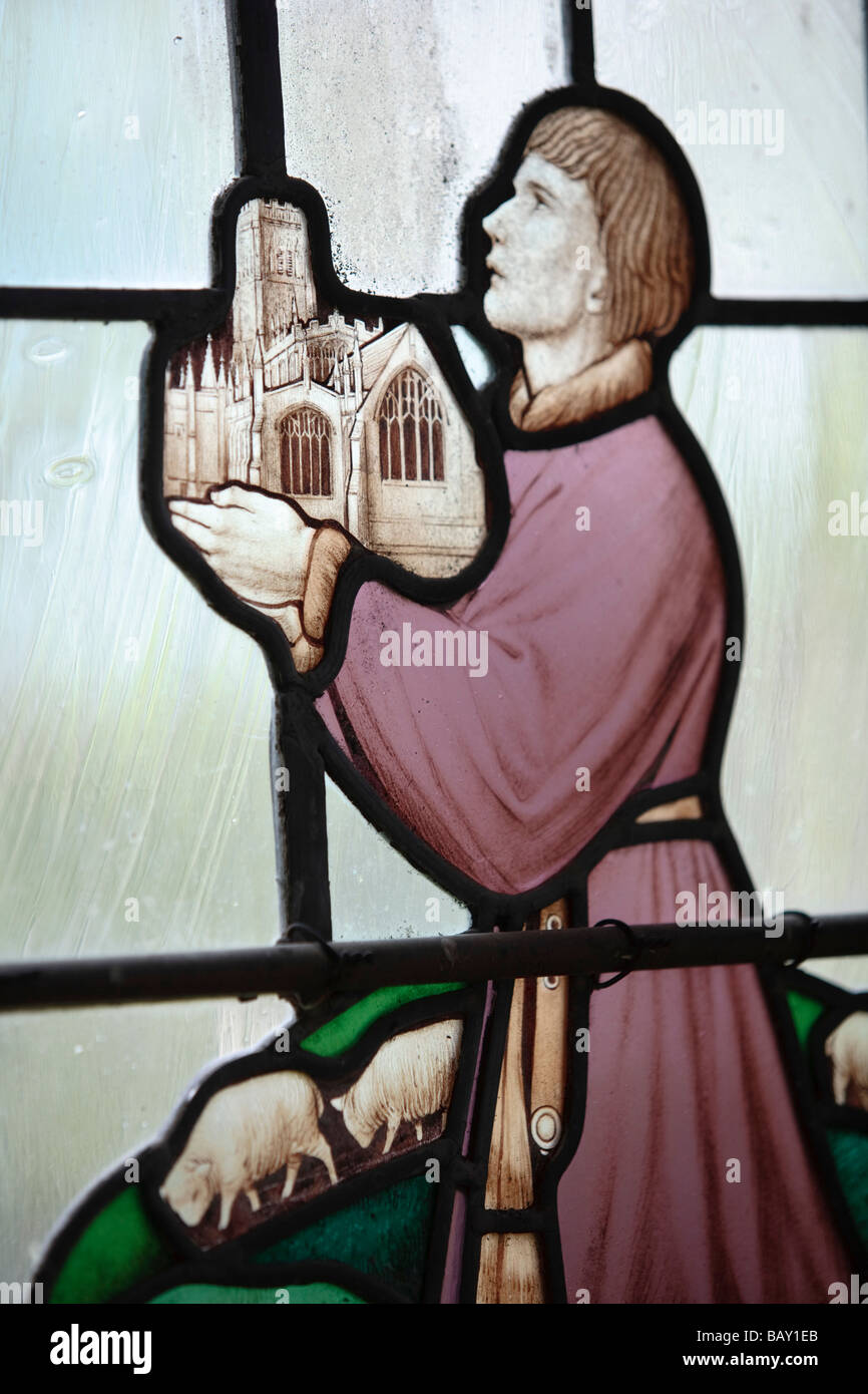 Il vetro macchiato immagine di un mercante di lana tenendo la lana la chiesa di San Pietro e San Paolo, Northleach, Gloucestershire, Regno Unito Foto Stock