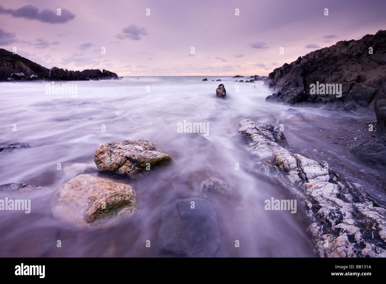 Il pendolamento marea a crepuscolo spiaggia Combesgate Woolacombe Devon England Foto Stock