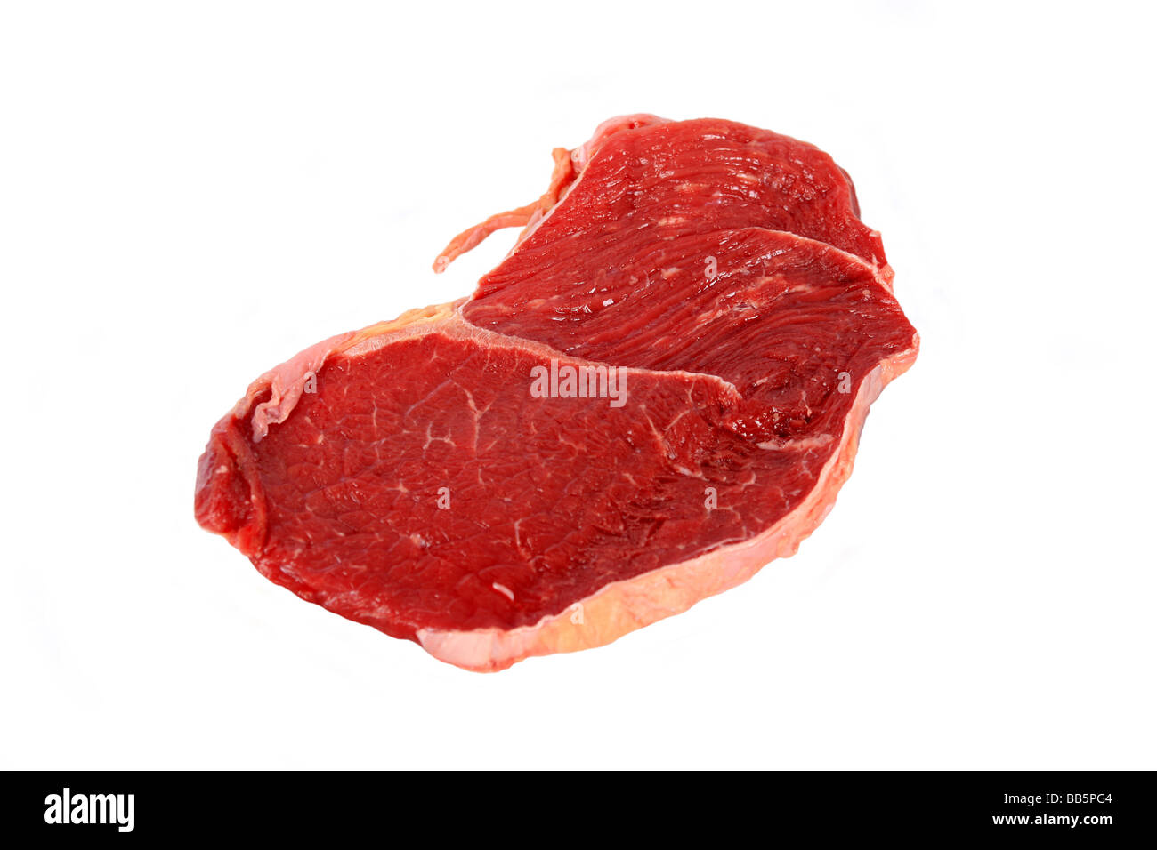 Pezzo di materie bistecca carne contro uno sfondo bianco Foto Stock