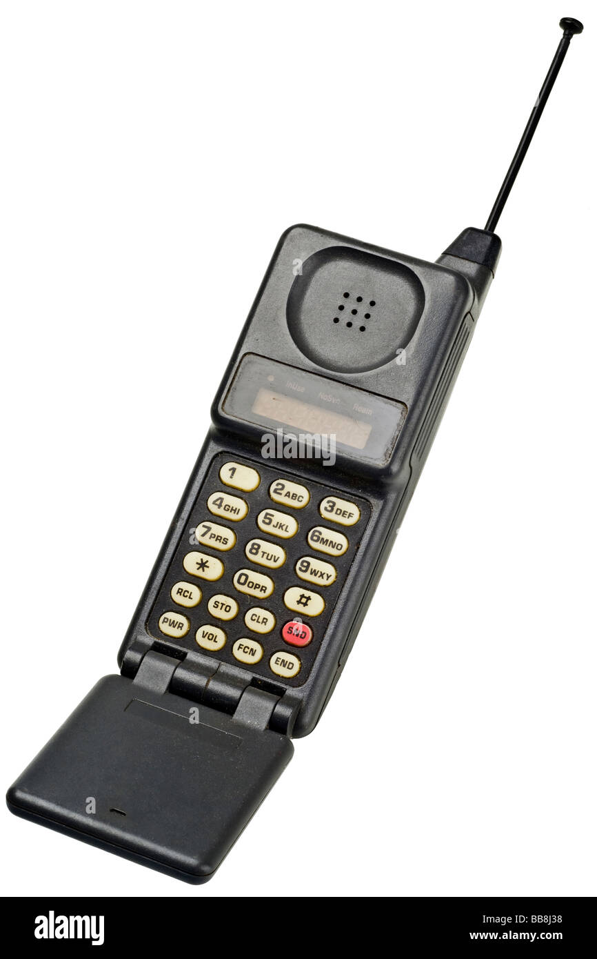 Un vecchio telefono cellulare su bianco Foto Stock