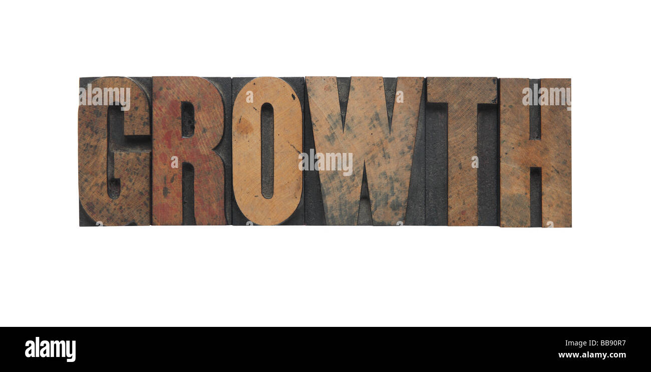 La parola "crescita" in legno vecchio tipo Foto Stock