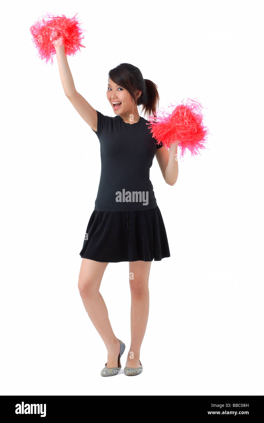 Giovane donna cheerleading con il pom pom Foto Stock
