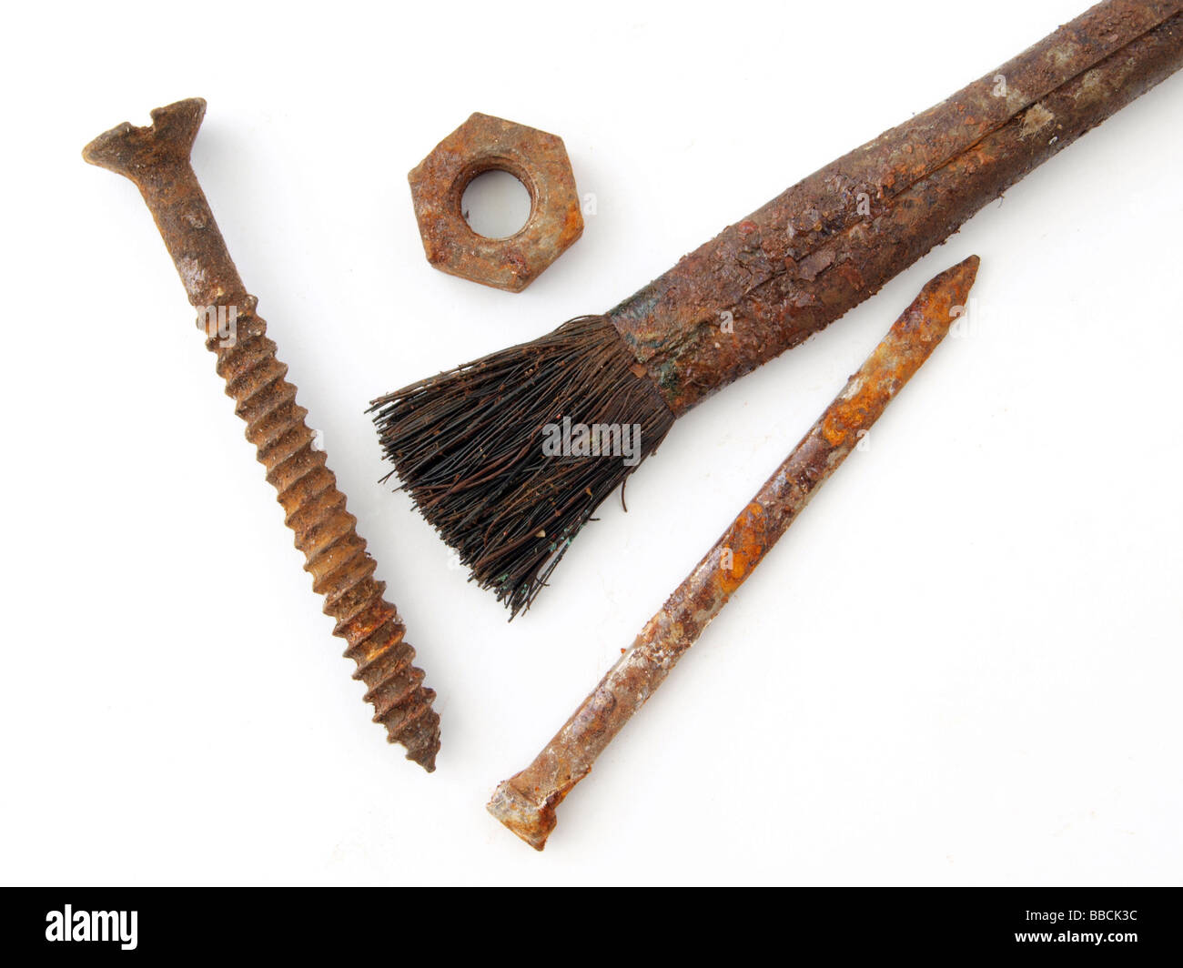Vecchia spazzola arrugginito chiodo a vite e dado Foto Stock