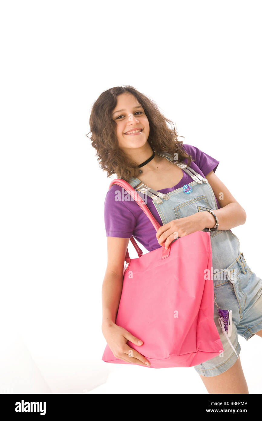 Sorridente ragazza con una borsa per la spesa Foto Stock