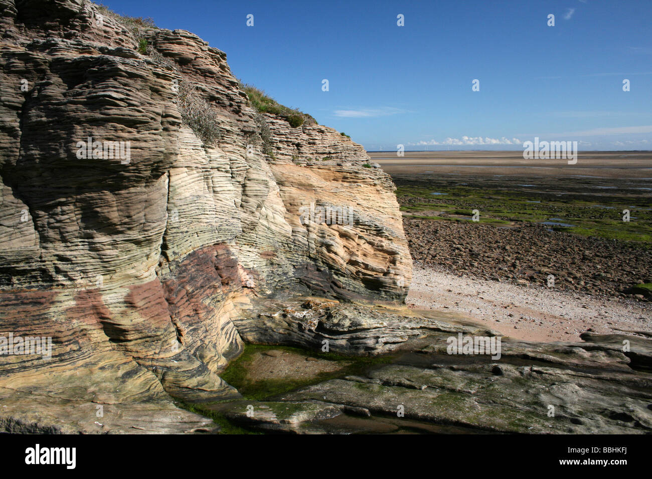 Strati di roccia in arenaria Bunter su Hilbre Island, il Wirral, Merseyside, Regno Unito Foto Stock
