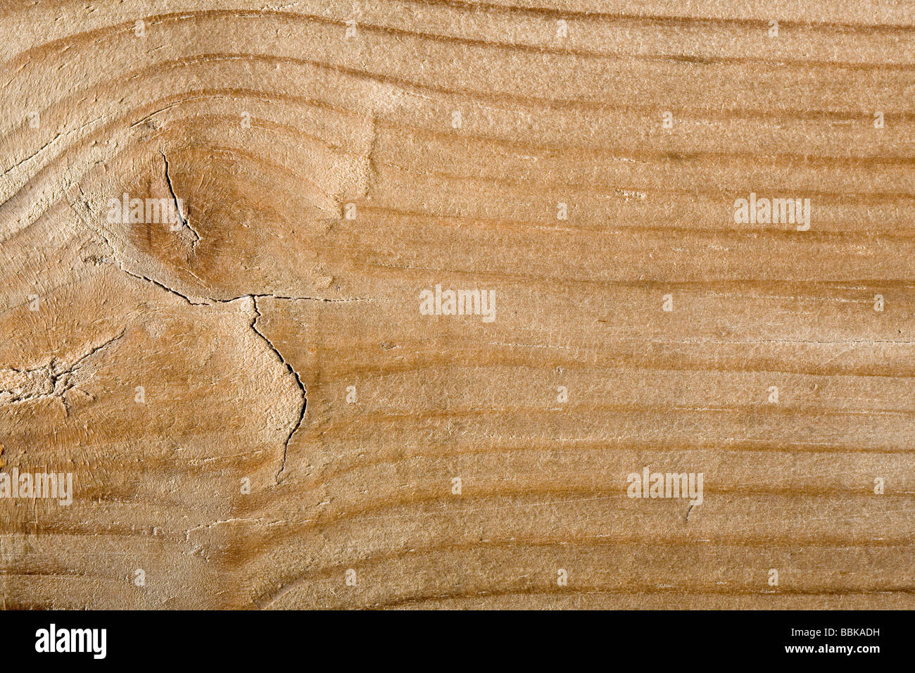 Una chiusura di grana di legno con un nodo Foto Stock Una chiusura di grana di legno con un nodo Foto Stock