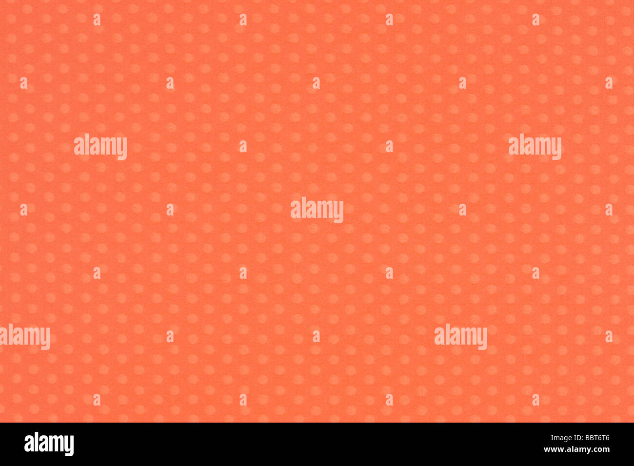 Orange art paper con la Polka Dots Foto Stock