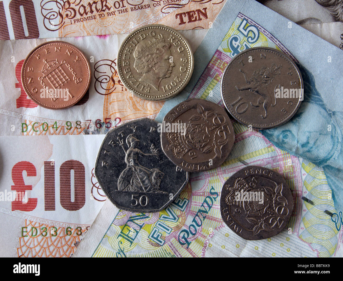 Close up della valuta britannica banconote e monete Foto Stock