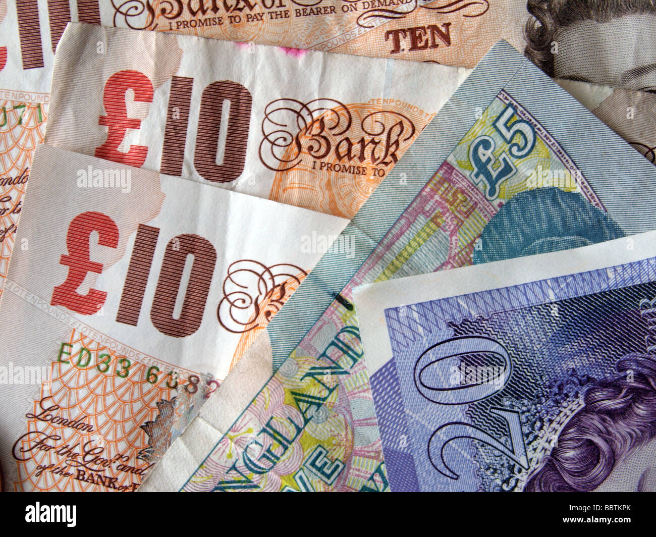 Close up della valuta britannica banconote e monete Foto Stock