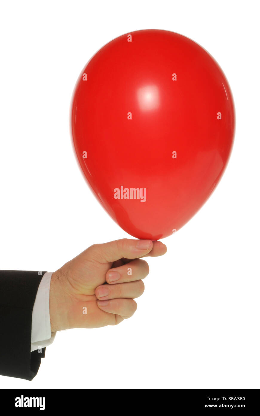 Manager la mano che tiene un palloncino Foto Stock