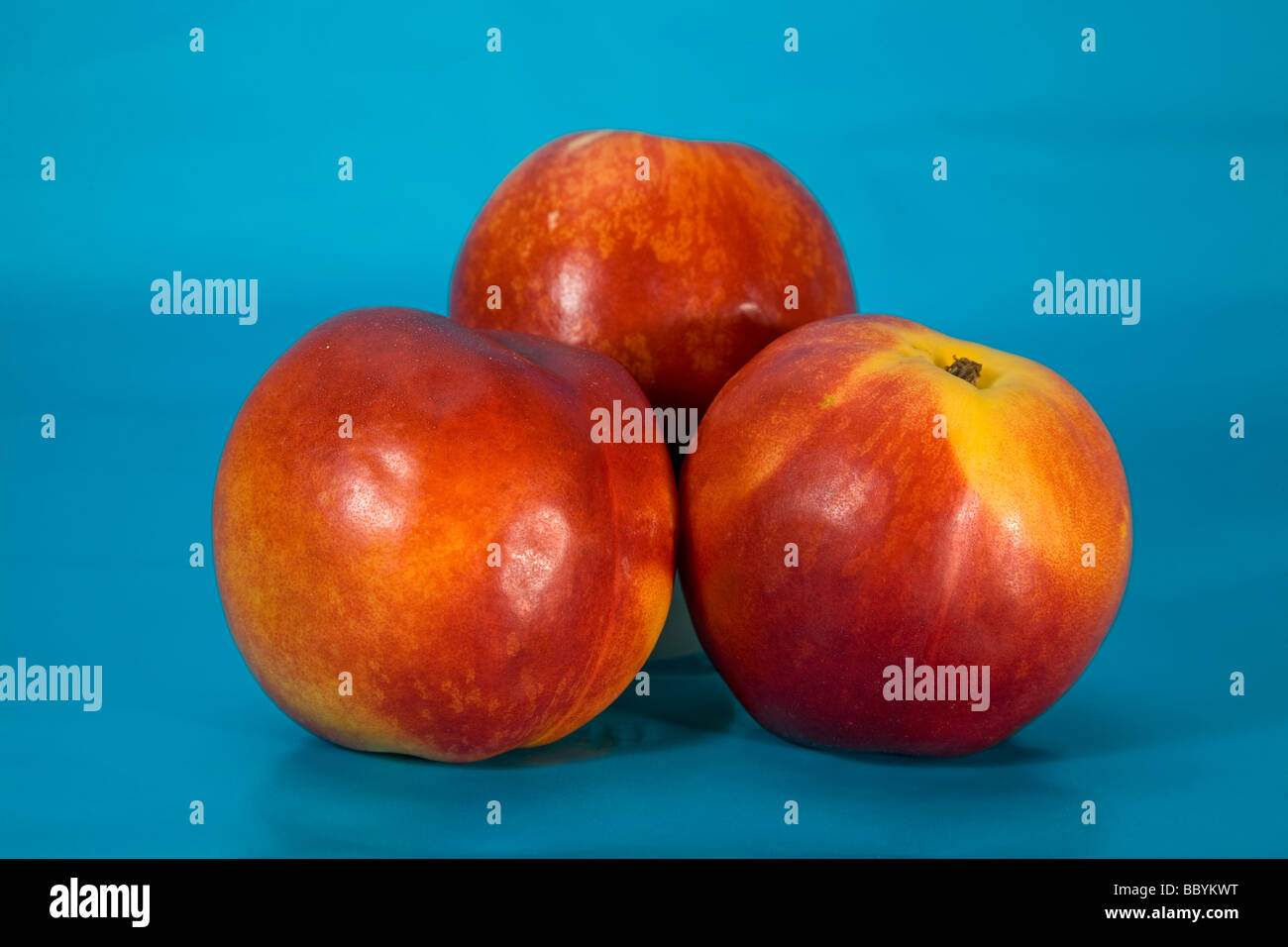 Tre le pesche noci Foto Stock