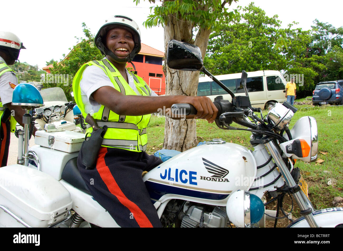 Il giamaicano poliziotta sul motociclo Foto Stock