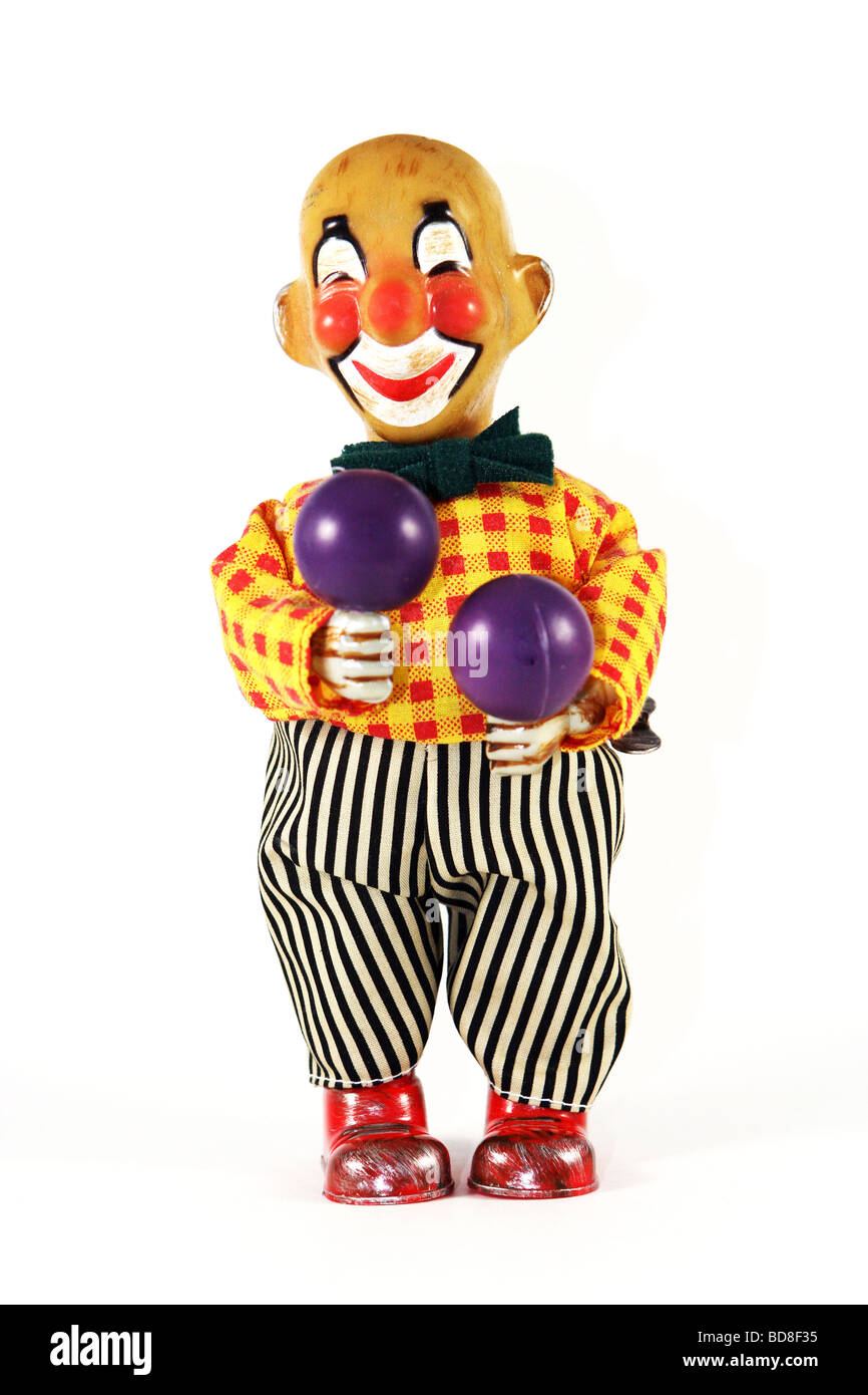 Vintage vento meccanico fino clown toy giocando le maracas Foto Stock