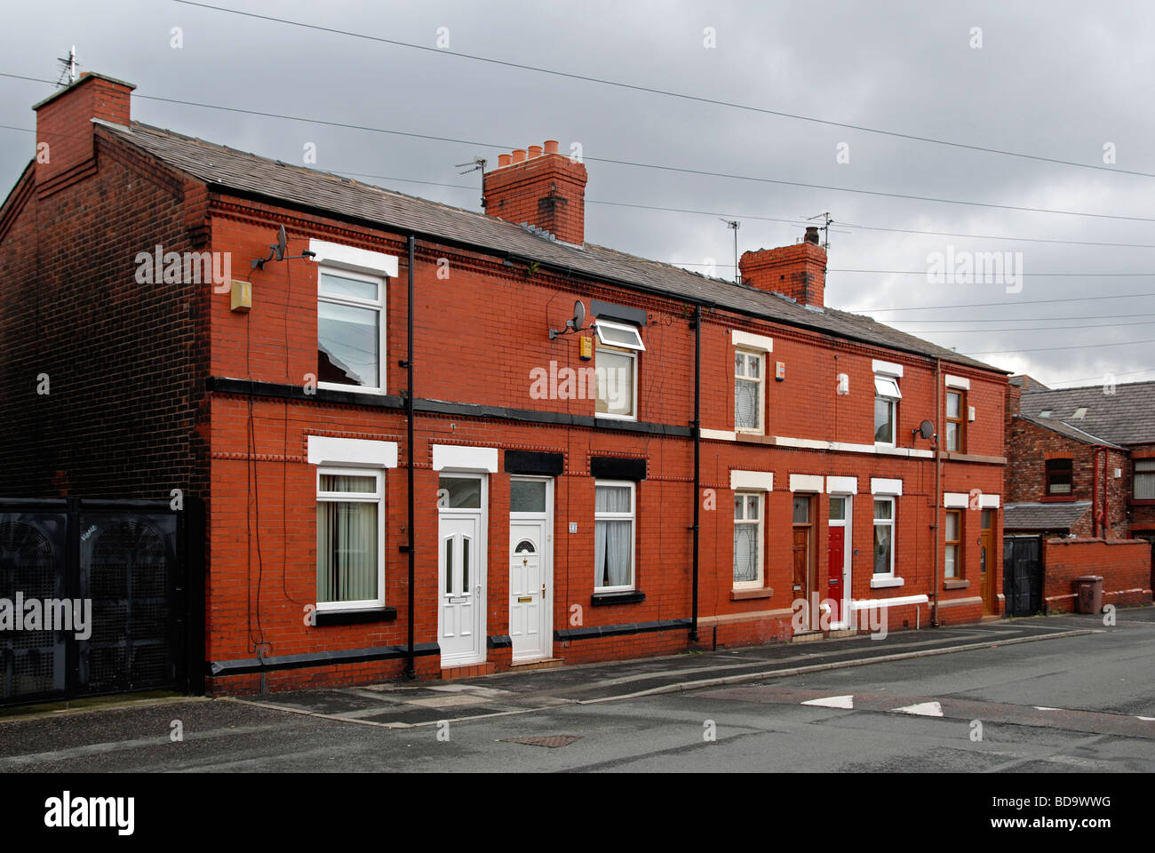 Una fila di inizio del XX secolo e ospita a WIGAN, LANCASHIRE, Regno Unito Foto Stock