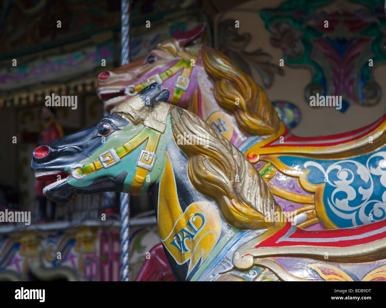 Cavalli sulla giostra Foto Stock