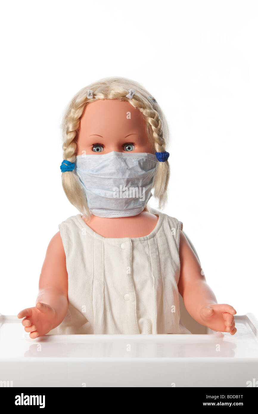 Una bambola con una bocca maschera per prevenire l'influenza Foto Stock