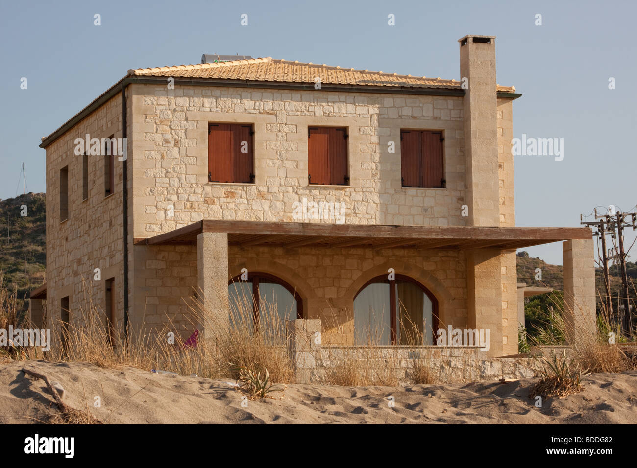Tradizionale spiaggia greca beachfront villa Foto Stock