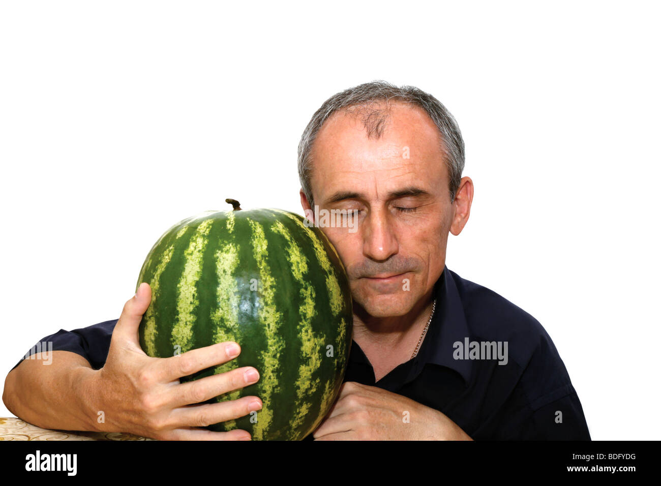 La persona ha chiuso gli occhi dal piacere di che esso ha un'acqua-melone Foto Stock