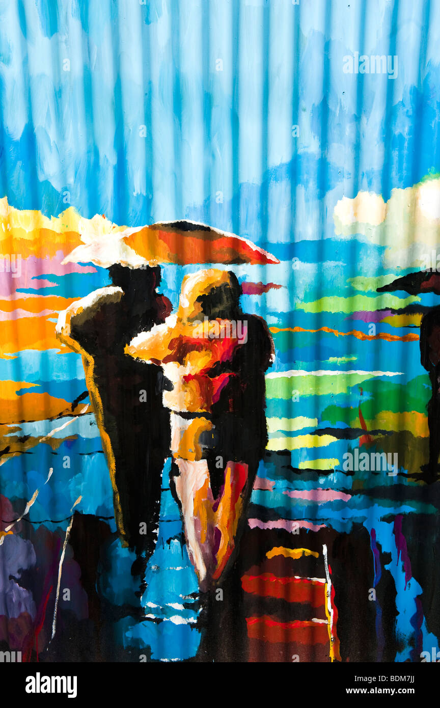 Un arte di strada la pittura di un giovane a piedi sotto la pioggia Foto Stock