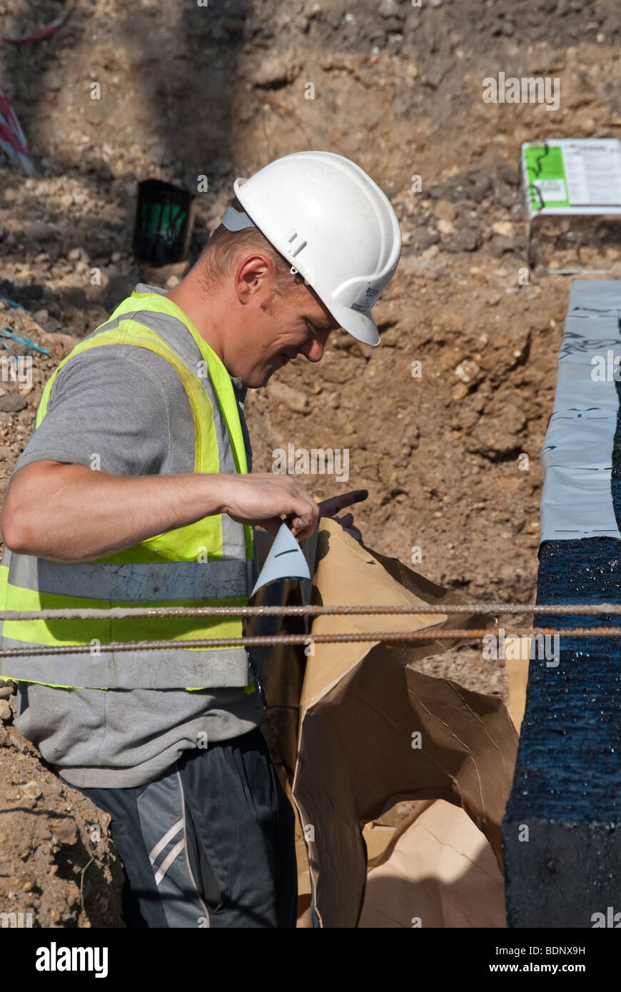 Lavoratori edili sul sito di costruzione Foto Stock