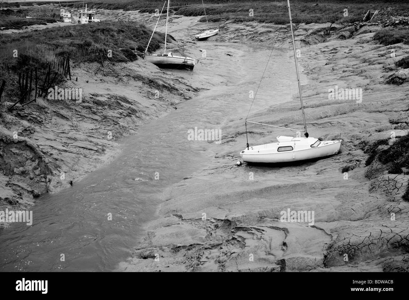 Barche a bassa marea su un tidal fiver Foto Stock