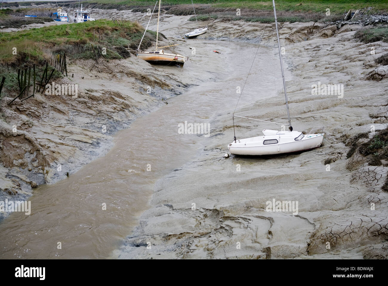 Barche a bassa marea su un tidal fiver Foto Stock