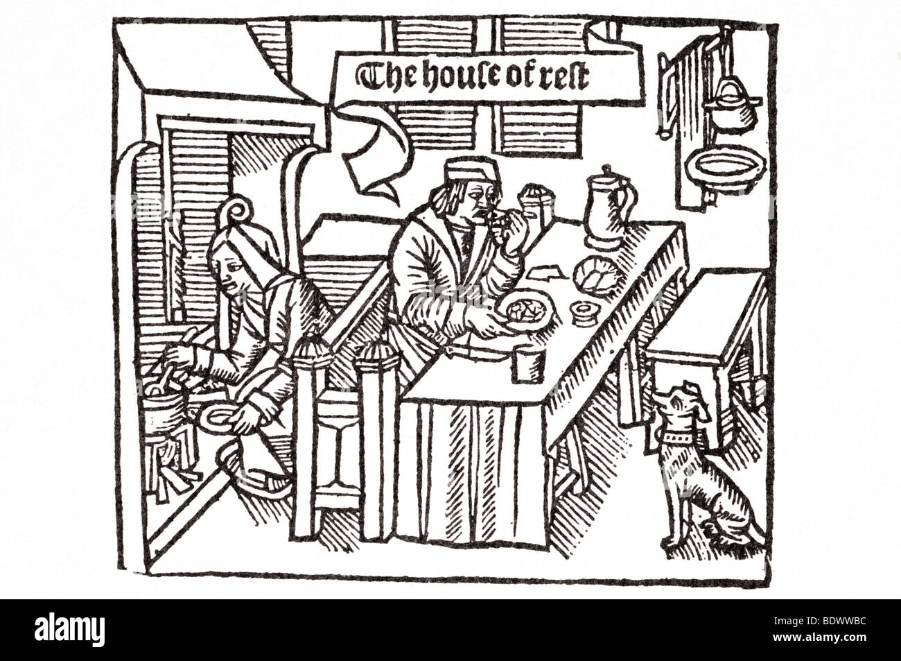 W de worde 1510 gringore pierre castello di labore una donna la piegatura su un fuoco posto un uomo seduto su un sette a mangiare una scheda lunga Foto Stock