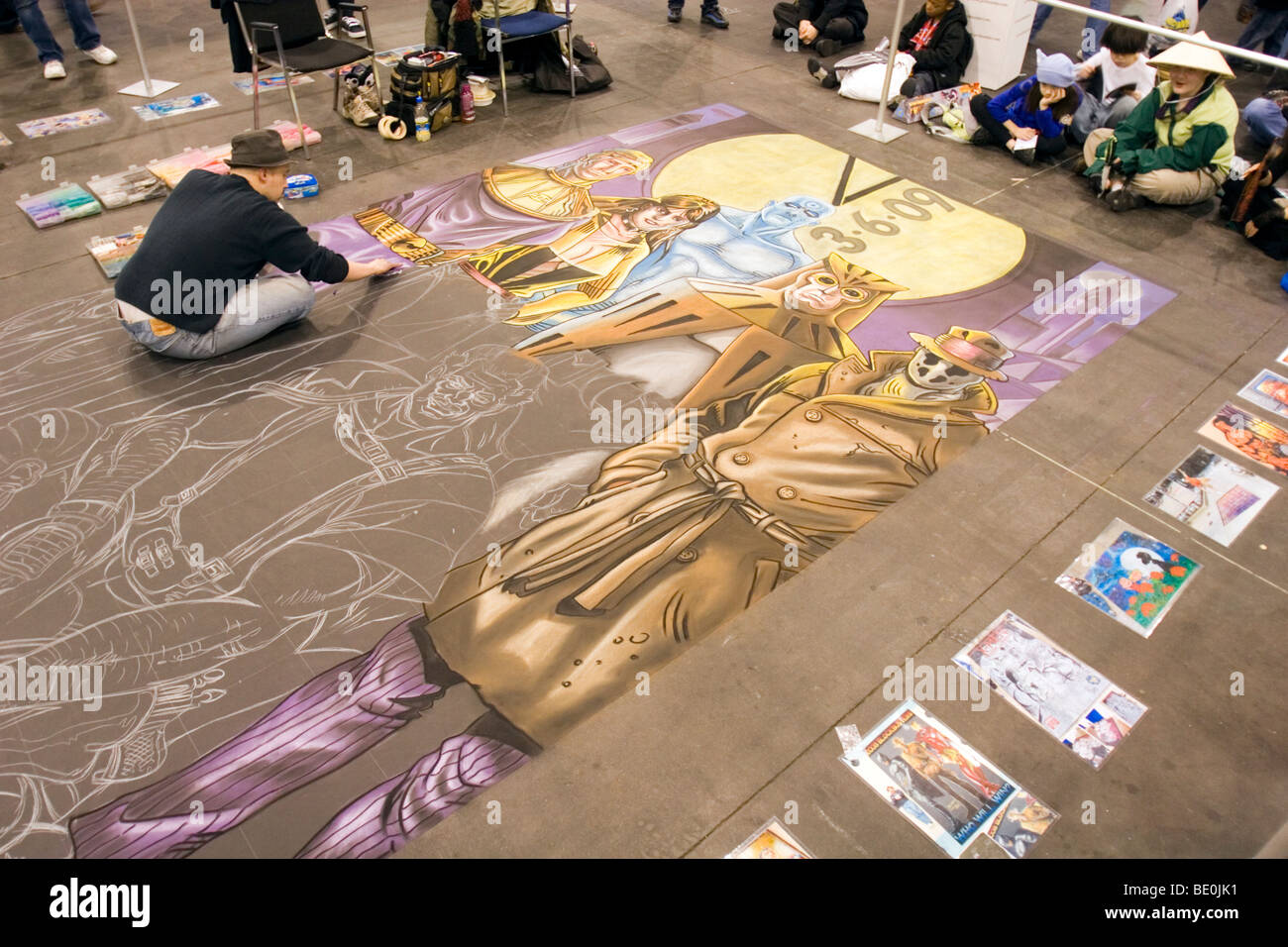 Disegna un artista sul pavimento al New York Comic Con. Foto Stock