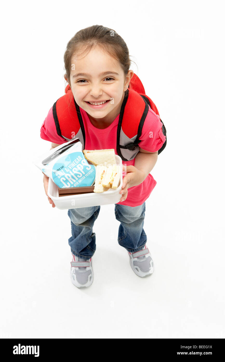 Ritratto in studio della ragazza sorridente Holding Lunchbox Foto Stock