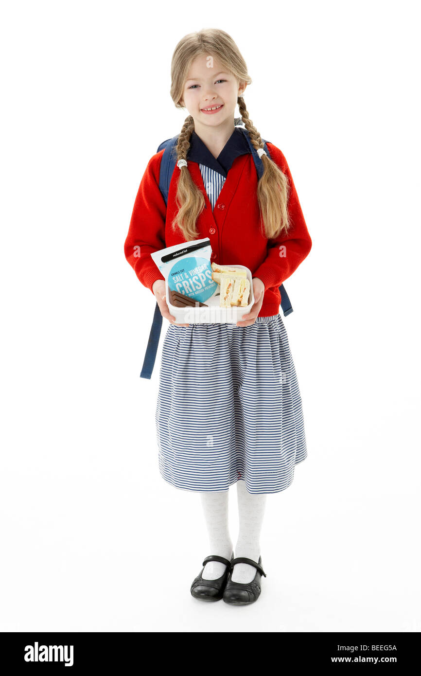 Ritratto in studio della ragazza sorridente Holding Lunchbox Foto Stock