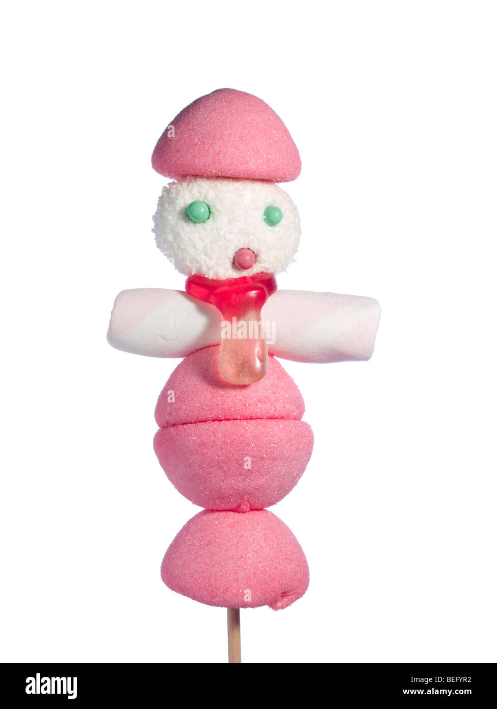 Un maschio figurina fatta di caramelle su un bastone su uno sfondo bianco. Foto Stock