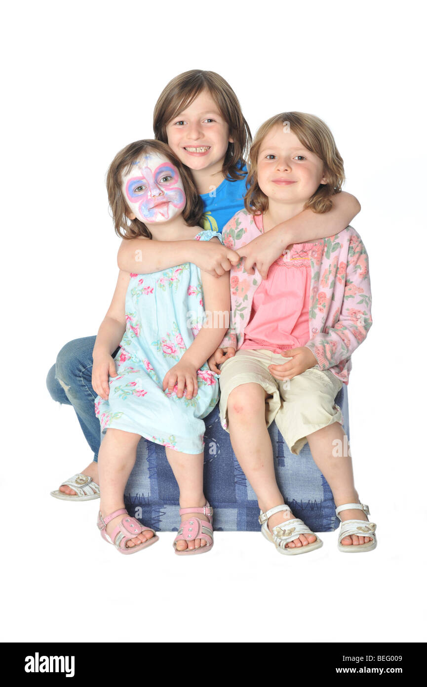 Le tre sorelle seduta,face paint Foto Stock