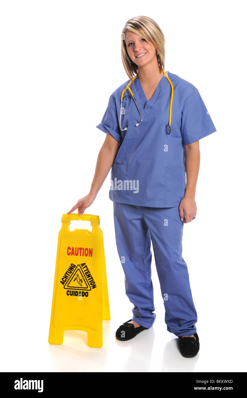 Operatore sanitario con il simbolo di sicurezza su sfondo bianco Foto Stock