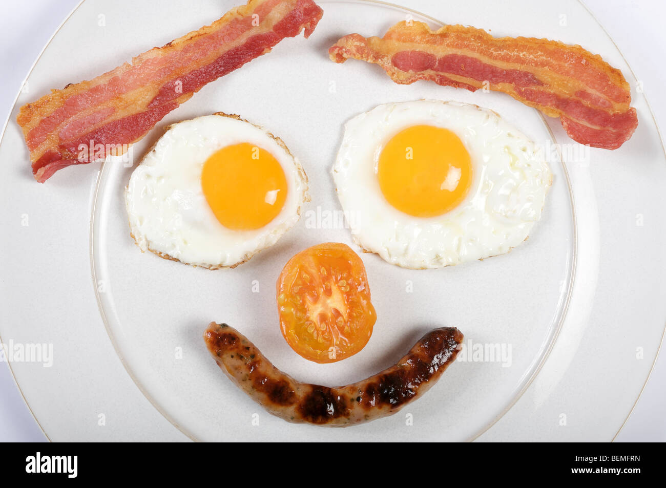 Prima colazione inglese tradizionale in forma di una faccia Foto Stock