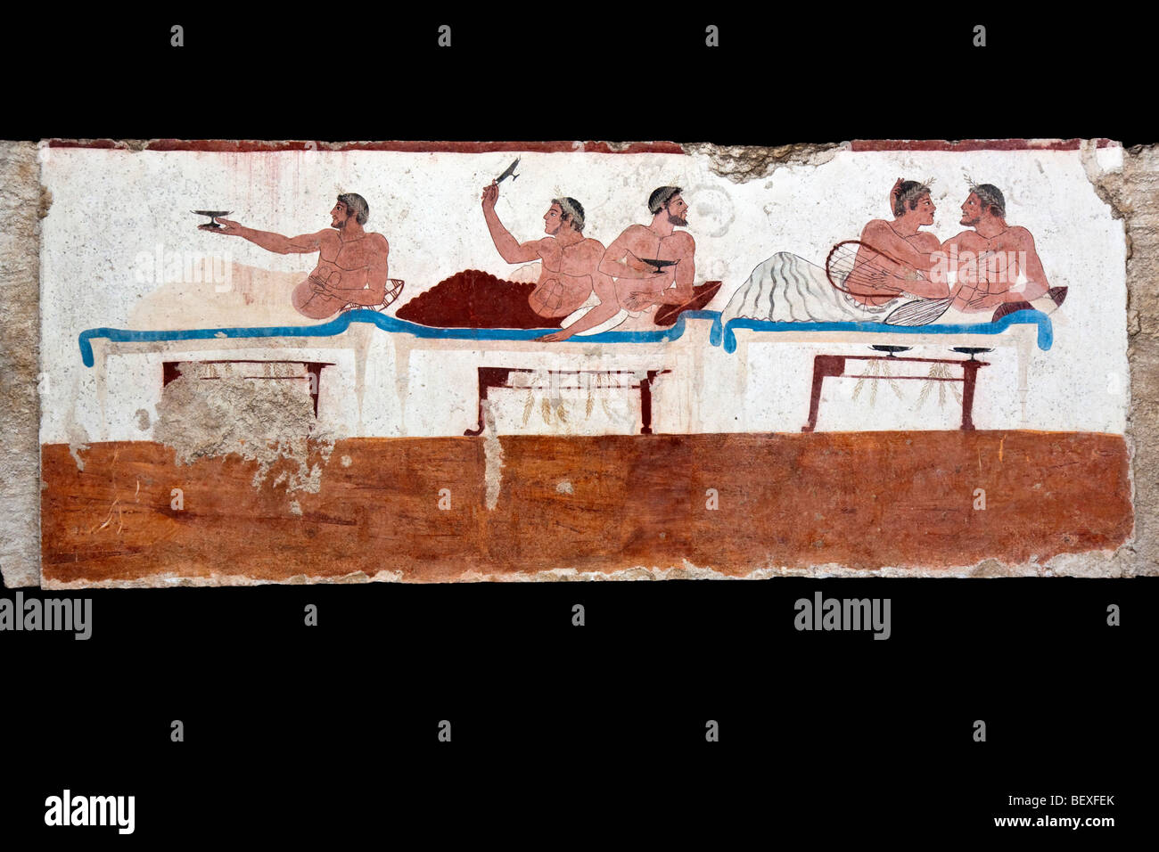 Simposio scena dalla Tomba del Tuffatore a Paestum, Italia. Foto Stock