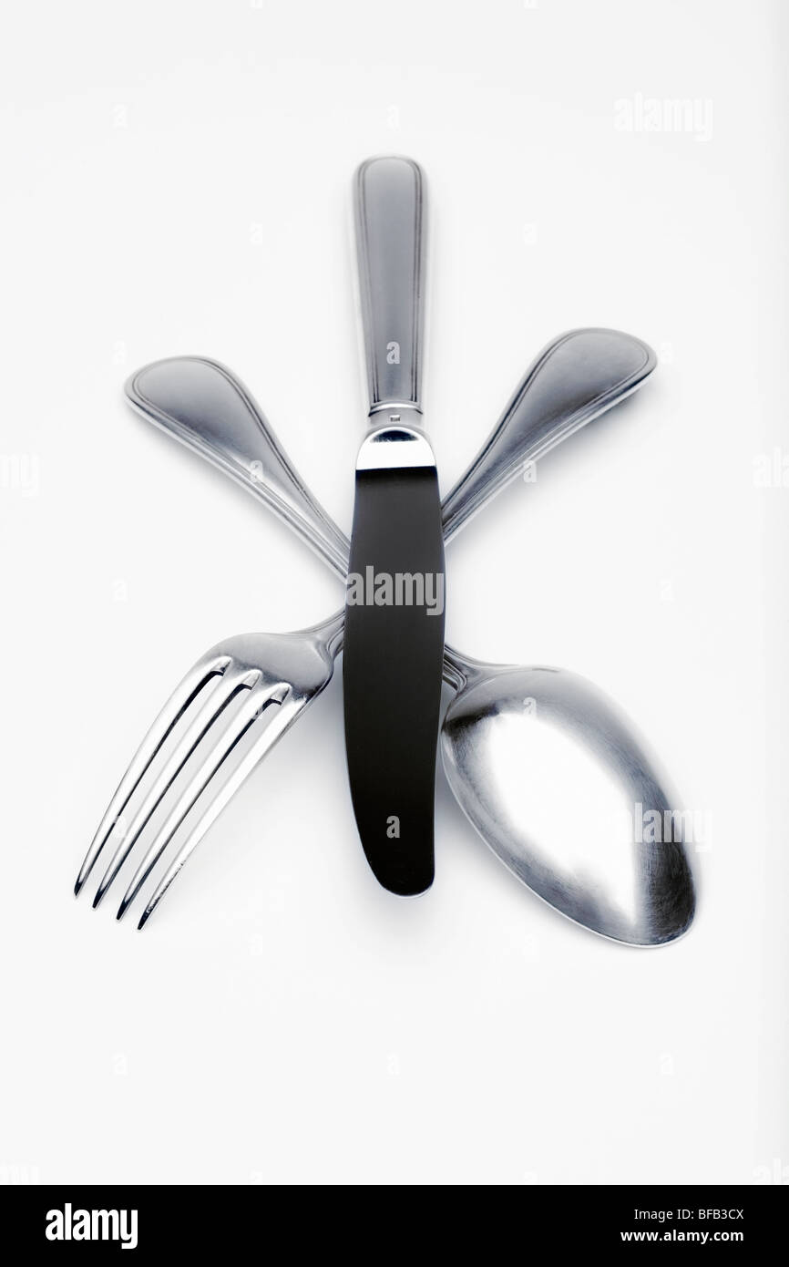Elegante argenteria - primo piano della forcella, un cucchiaio e un coltello Foto Stock