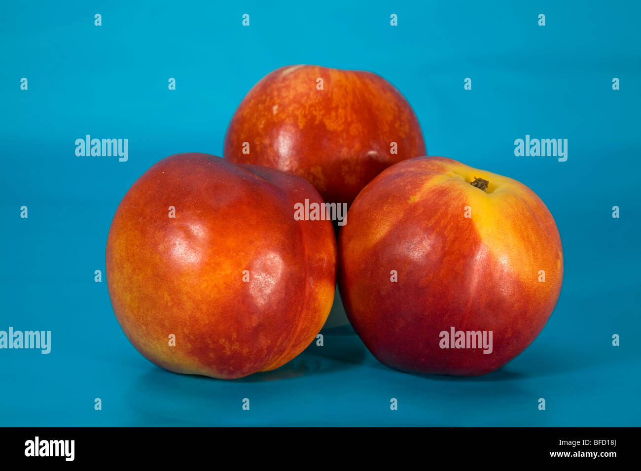 Tre le pesche noci Foto Stock