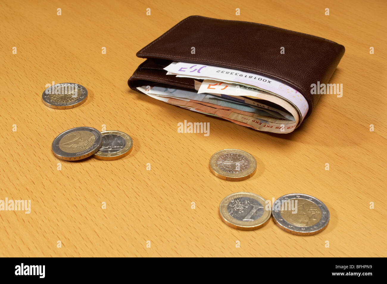 Portafogli pieno di denaro Foto Stock